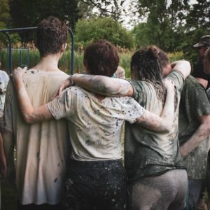 a group of people discussing teamwork factors during a team building activity