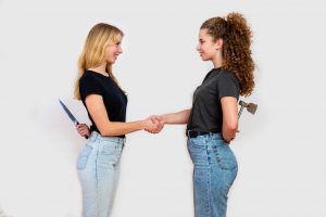 two women backstabbing in the workplace