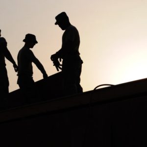 Silhouette of 3 construction laborers as one of the best paying temporary jobs