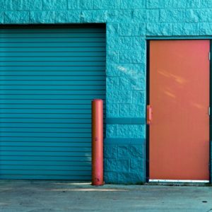 A blue door and a red door which represents the confusion between job or career