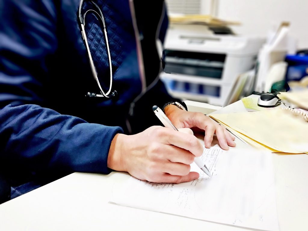 doctor wearing a stethoscope at work