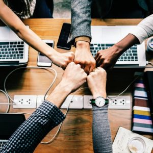 fist bumping in the workplace implies high office morale