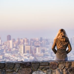 back view of a girl over looking buildings while thinking of the best resume writing service