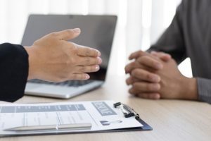 hiring manager ready to shake hands but the job applicant not yet