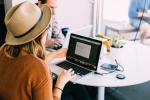 Girl intern working in front of a laptop