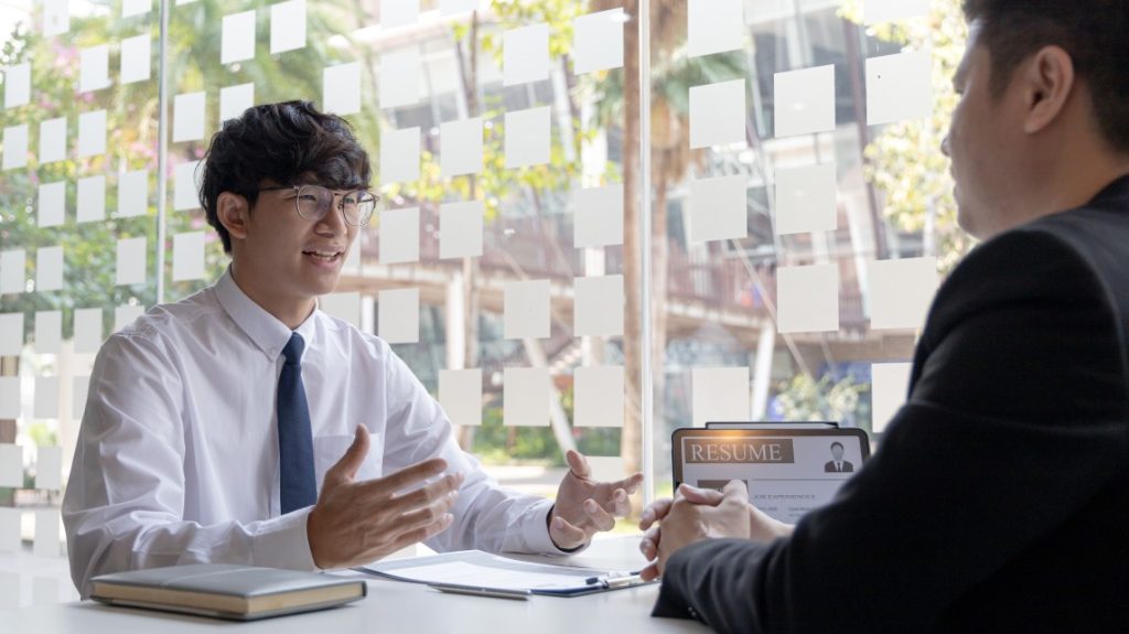 The job applicant is doing well in the interview with his interview checklist