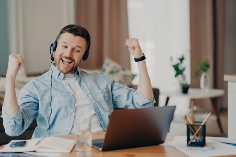 job applicant celebrating after getting hired with help of interview checklist