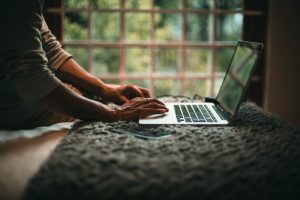 Man searching for ways to update your resume in his laptop