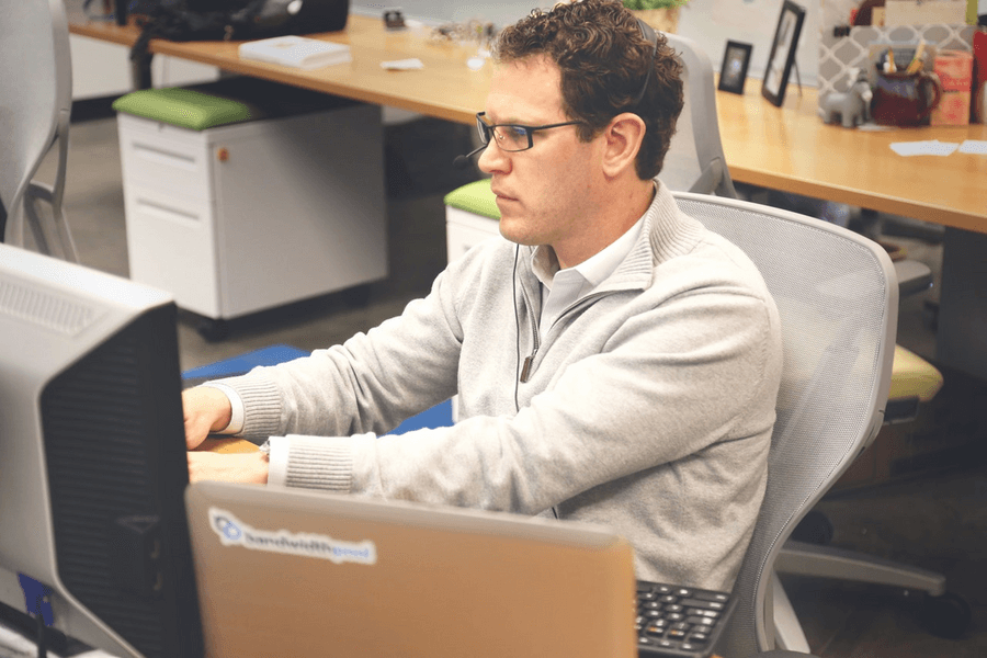 man working with family picture at the back