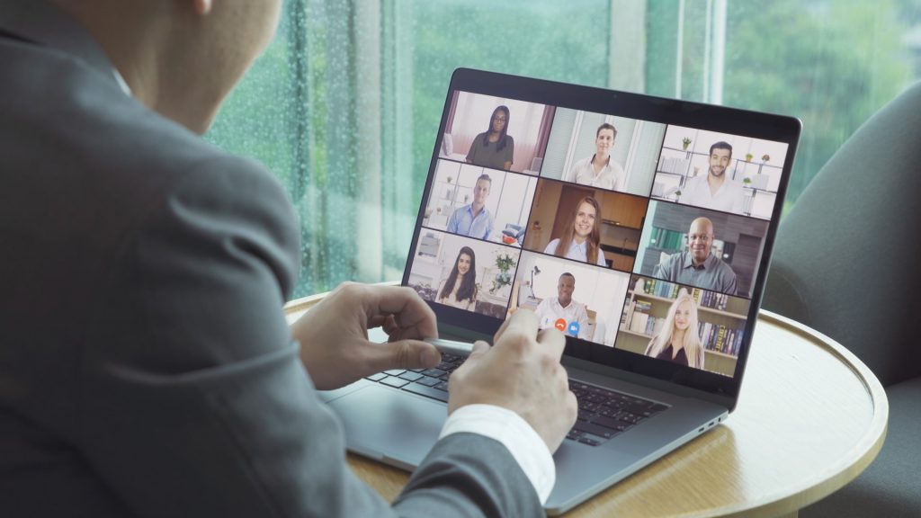 multiracial workers on video meeting