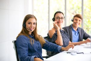 Three employee smiling and happy in their jobs