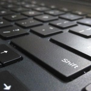 shift button from a laptop keyboard to represent perfect resume for career shifters