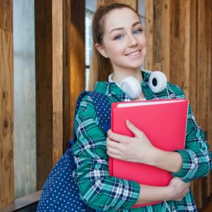 Girl student holding a red folder choosing a college degree