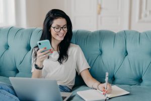 woman taking notes on job application resume sample tips