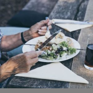 Woman eating salad as part of dinner interview